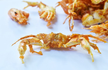 deep fried little swimming crab and shrimp with flour on white background