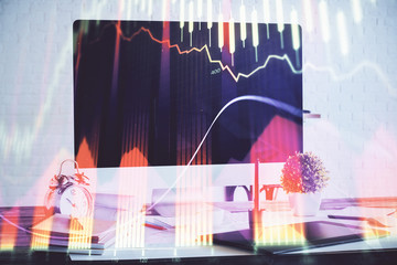 Forex Chart hologram on table with computer background. Multi exposure. Concept of financial...