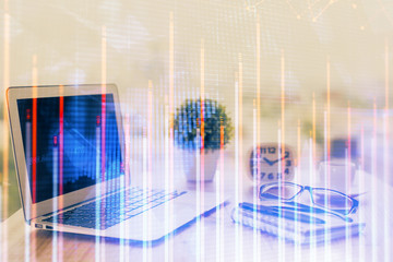 Forex Chart hologram on table with computer background. Multi exposure. Concept of financial markets.