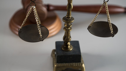Scale of justice. Wooden judge`s gavel. The criminal law. Low concept