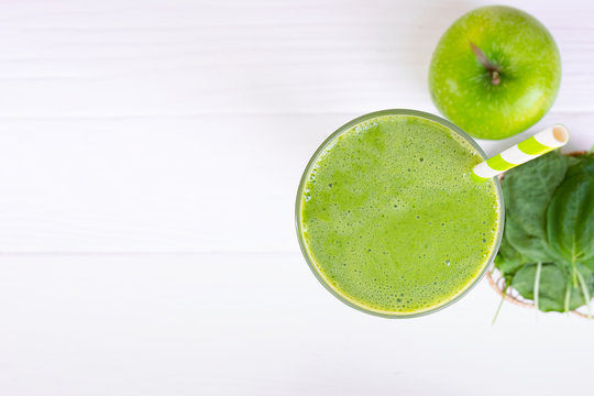 Spinach mix apple smoothie green juice beverage healthy the taste yummy in glass for on white wood background from the top view