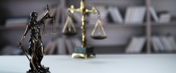 Scale of justice. Wooden judge`s gavel. The criminal law. Low concept