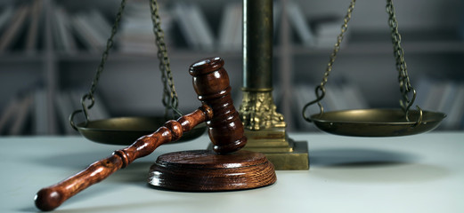 Wooden judge`s gavel. The criminal law. Low concept