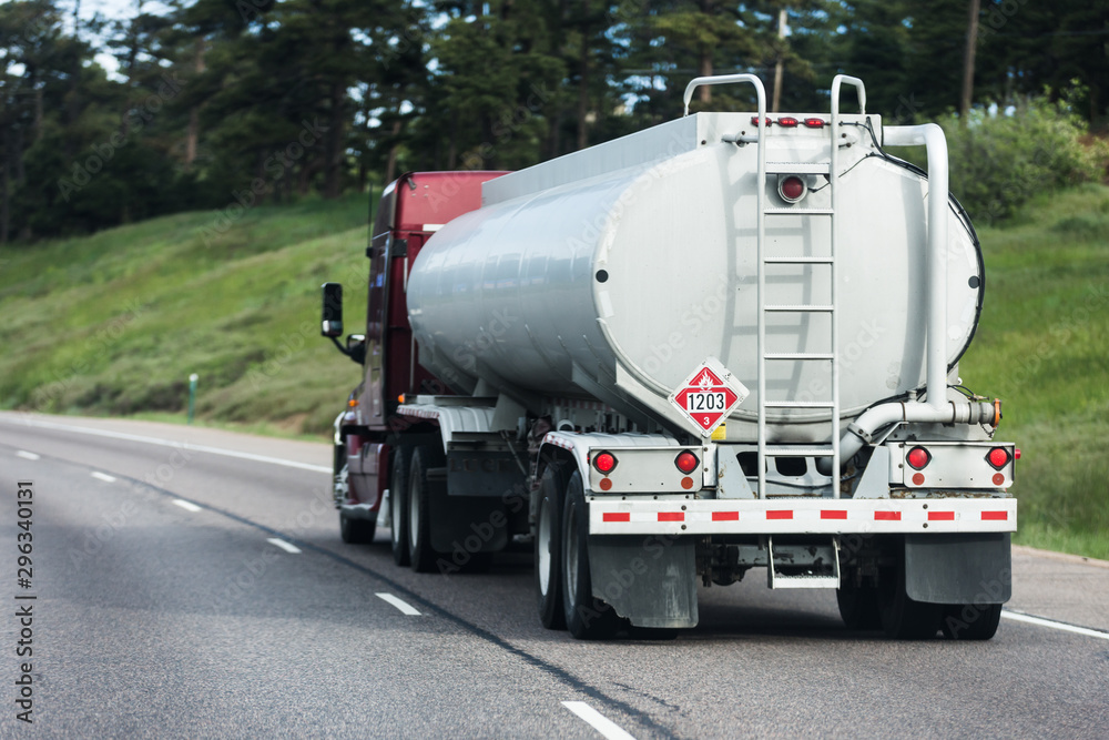 Wall mural Large tanker truck hauling on highway