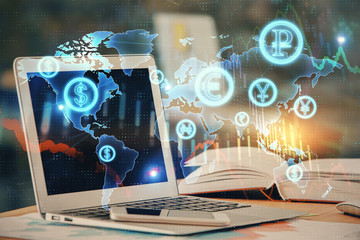 Forex graph hologram on table with computer background. Double exposure. Concept of financial markets.