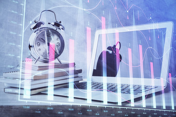 Forex market chart hologram and personal computer background. Multi exposure. Concept of investment.