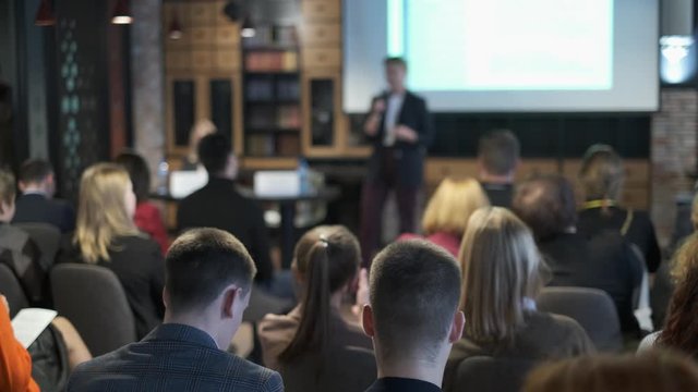 Audience listens lecturer at workshop