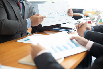 Team business analysts make decisions about the US economy that affect future operations of the...