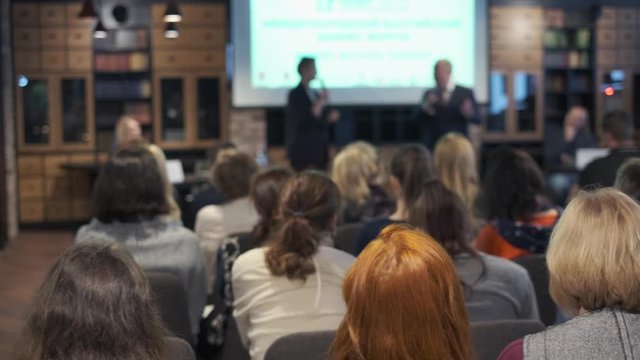 Audience listens lecturer at workshop