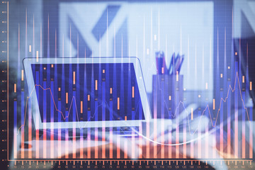 Financial chart drawing and table with computer on background. Double exposure. Concept of international markets.