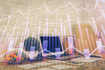 Financial chart drawing and table with computer on background. Multi exposure. Concept of international markets.