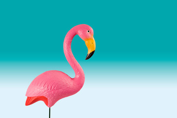 Fototapeta premium pink flamingo on a blue gradient background