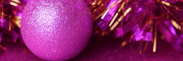  Pink christmas decorations on shiny pink background. Christmas background
