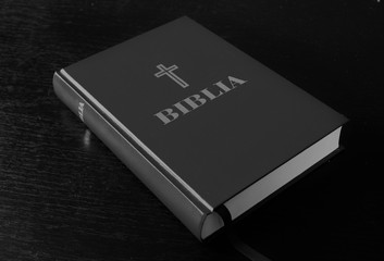 a bible on a black background