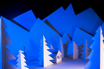 Snowy landscape of high mountain with white pines, and house in the middle of the landscape.