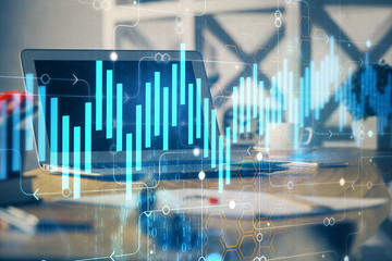 Financial chart drawing and table with computer on background. Multi exposure. Concept of international markets.