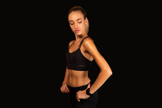 Sporty Girl Posing Over Black Background, Studio Shot