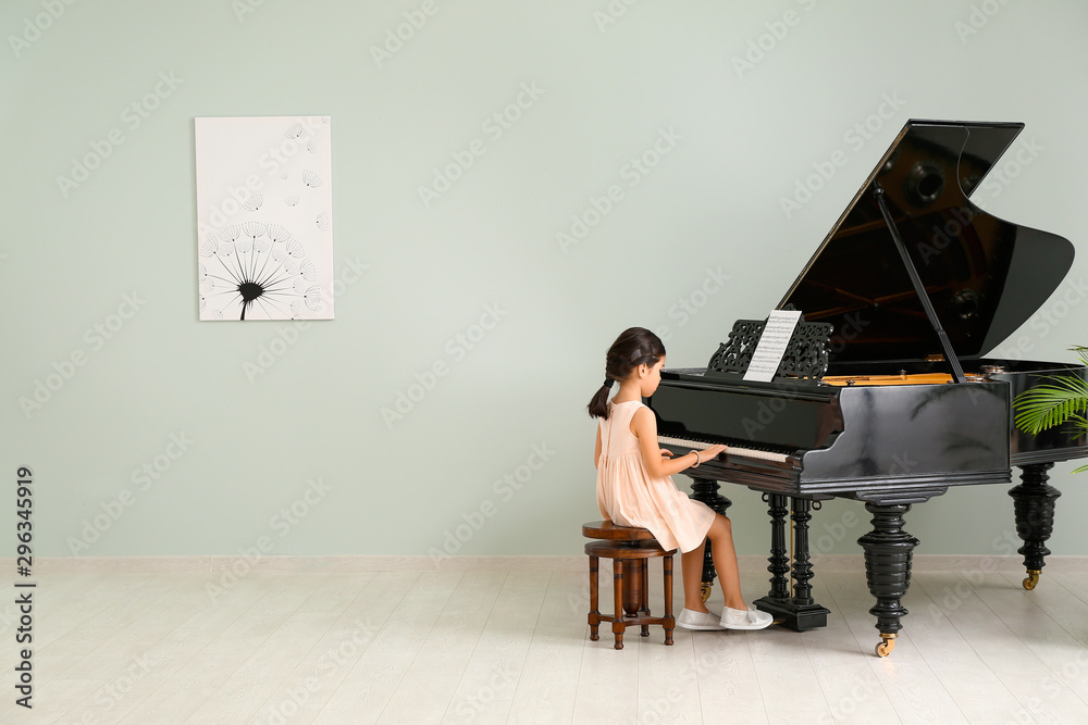 Sticker little girl playing grand piano at home