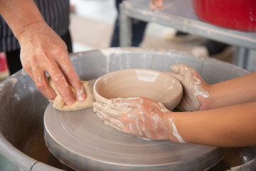 Teaching to make pottery