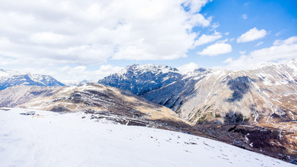 Fototapeta na wymiar Mountains in winter, slopes and pistes, Livigno village, Italy, Alps