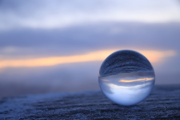 Sunrise through a glass ball
