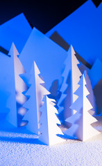 Snowy landscape of high mountain with white pines, and house in the middle of the landscape.