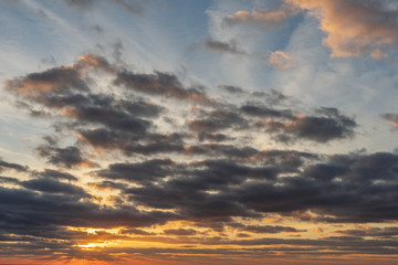 Sunset / sunrise with clouds, light rays and other atmospheric effect