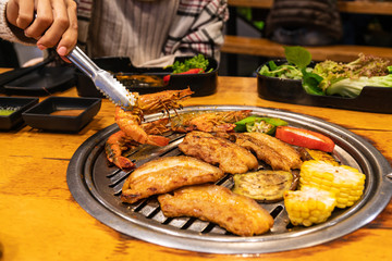 Streaky pork , shrimp and vetgetable on charcoal grill for barbecue korean or Japanese style yakiniku.