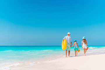Happy beautiful family on a tropical beach vacation - 296349150