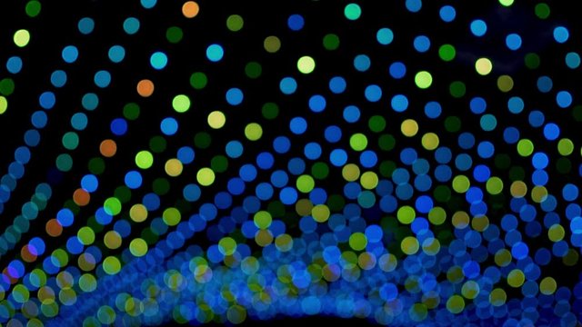  Colorful garlands lights circles sparkle  blink shimmer with different colors at the festive event party holiday Christmas birthday, blurr