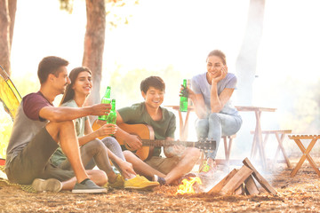 Young friends spending weekend in forest