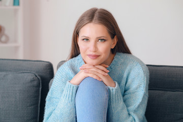 Portrait of beautiful young woman at home