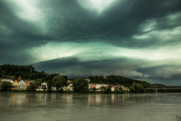 Stormfront over river, Passau, Germany