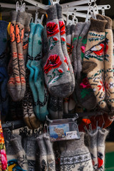 Fototapeta na wymiar Beautiful wool knitted socks are for sale on the market.