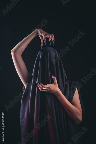 A Girl With Long Hair In The Image Of A Witch Is Trying To Set