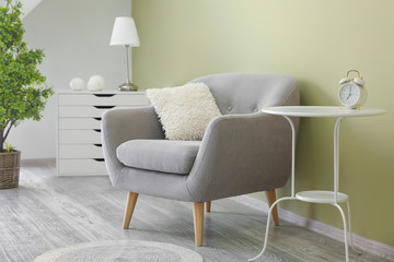 Interior of modern room with comfortable armchair