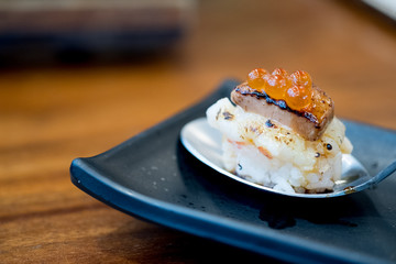 Close up Botan Shrimp and Foie Gras Truffles sushi.