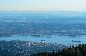 Grouse Mountain is one of the North Shore Mountains in the North Vancouver, British Columbia, Canada. It’s a top attraction of Vancouver, BC. Scenic from the peak with downtown view 