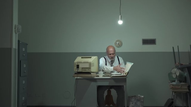 Vintage style corporate businessman working in the office