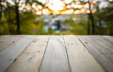 Autumn background with nature and in ground wooden planks