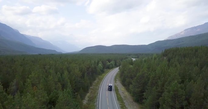 Sprinter Van driving through norwegian forest