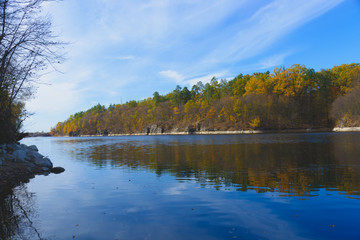 Panorama of autumn landscape with colorful forest, river
