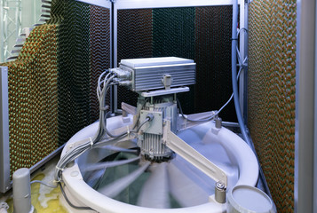 Closeup : Evaporator and electric motor fan, controler box inside a Evaporative Cooler - Active Cooling System