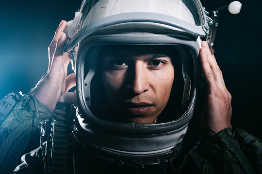 Man posing dressed as an astronaut in skyrocket elevator