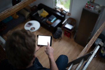 Architect using digital tablet for loft conversion