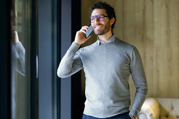 Smiling businessman talking on the phone