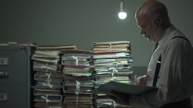Businessman reading a document in the office