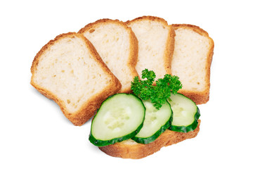Сucumber sandwich decorated with parsley, stack of white wheat bread slices for toasts