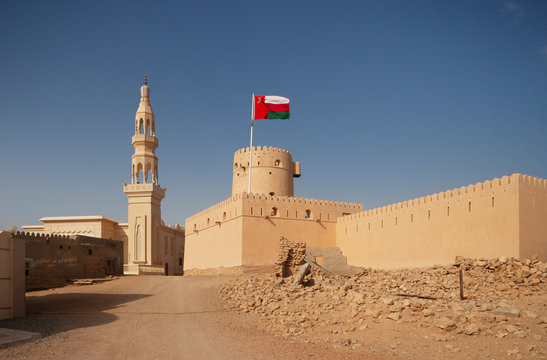 Sultanate Of Oman, Ras al Hadd, Ras al Hadd Castle with Omani flag and minaret