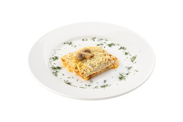 homemade vegetarian lasagna with champignon mushrooms isolated on white background
